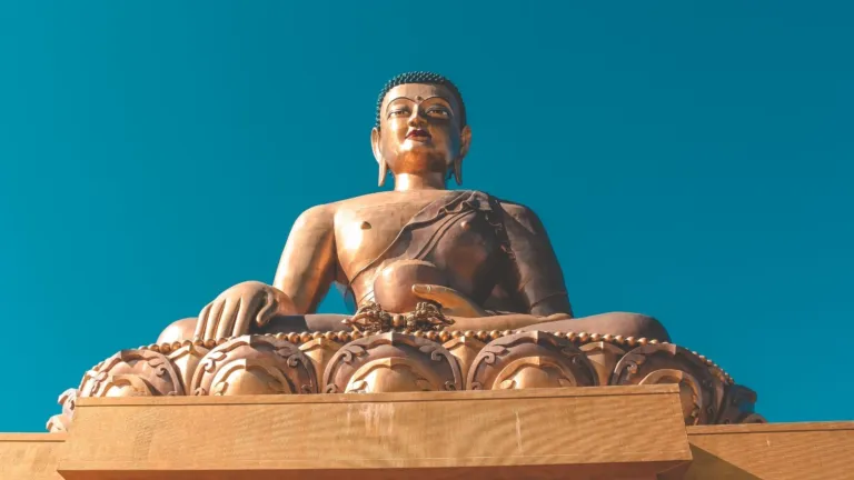 Buddha Dordenma statue against a clear blue sky above Thimphu